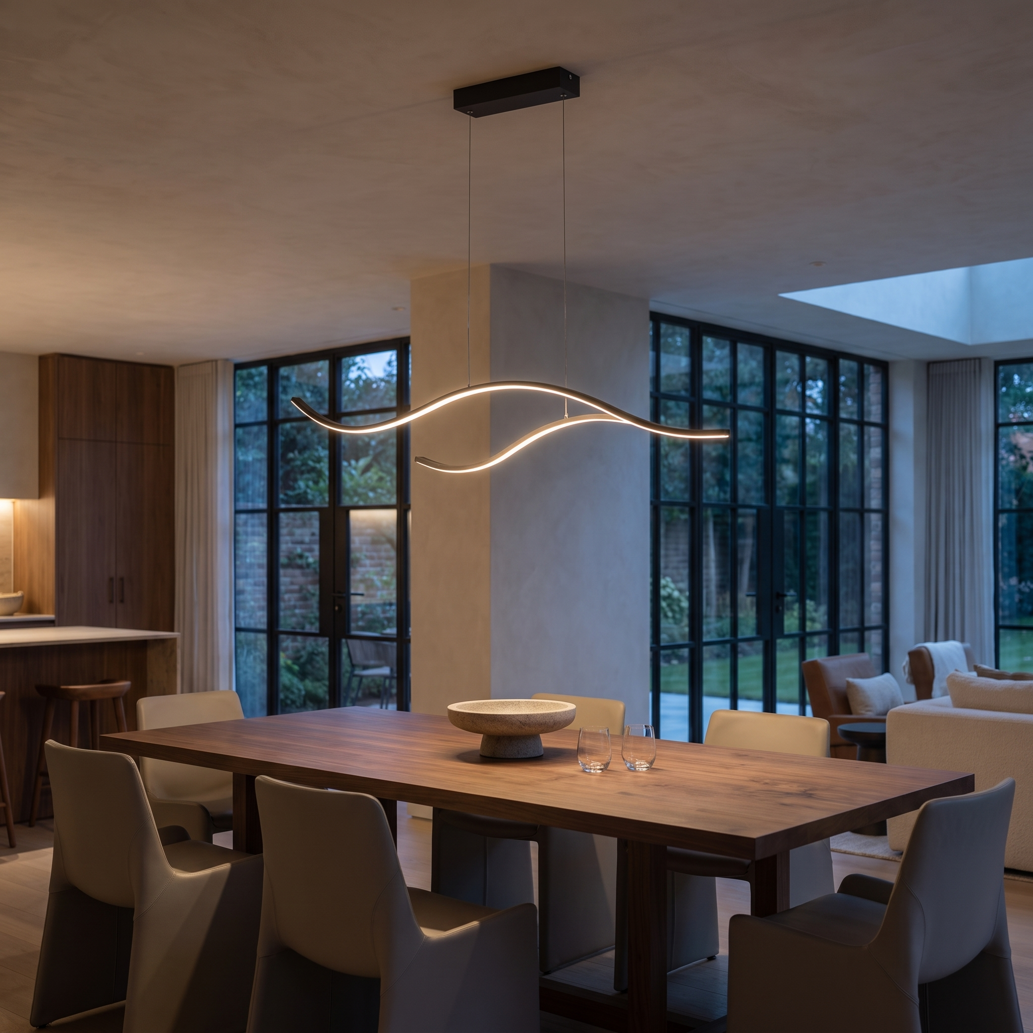 Aurelis Wavy Linear LED Pendant Light in a modern luxury dining room