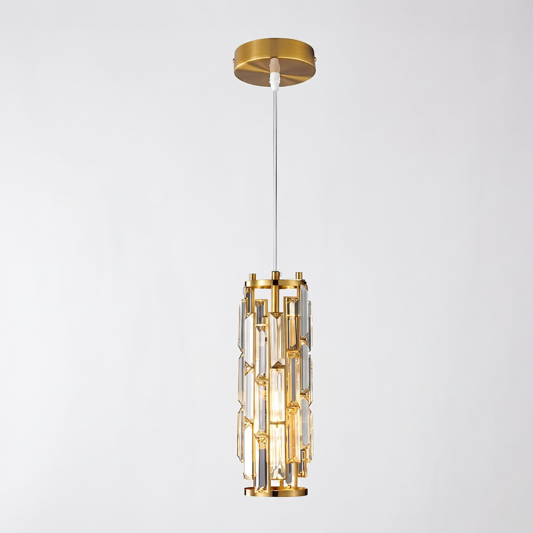 Gold Aurelique cylinder crystal pendant studio shot