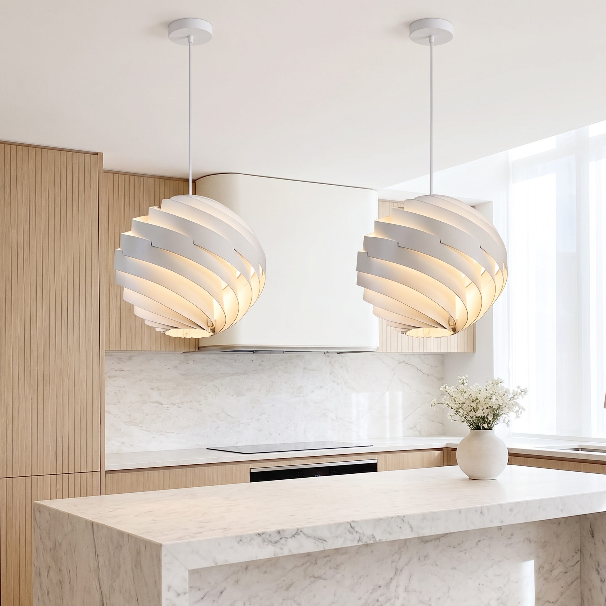 White Vortale swirl pendant light over a marble kitchen island