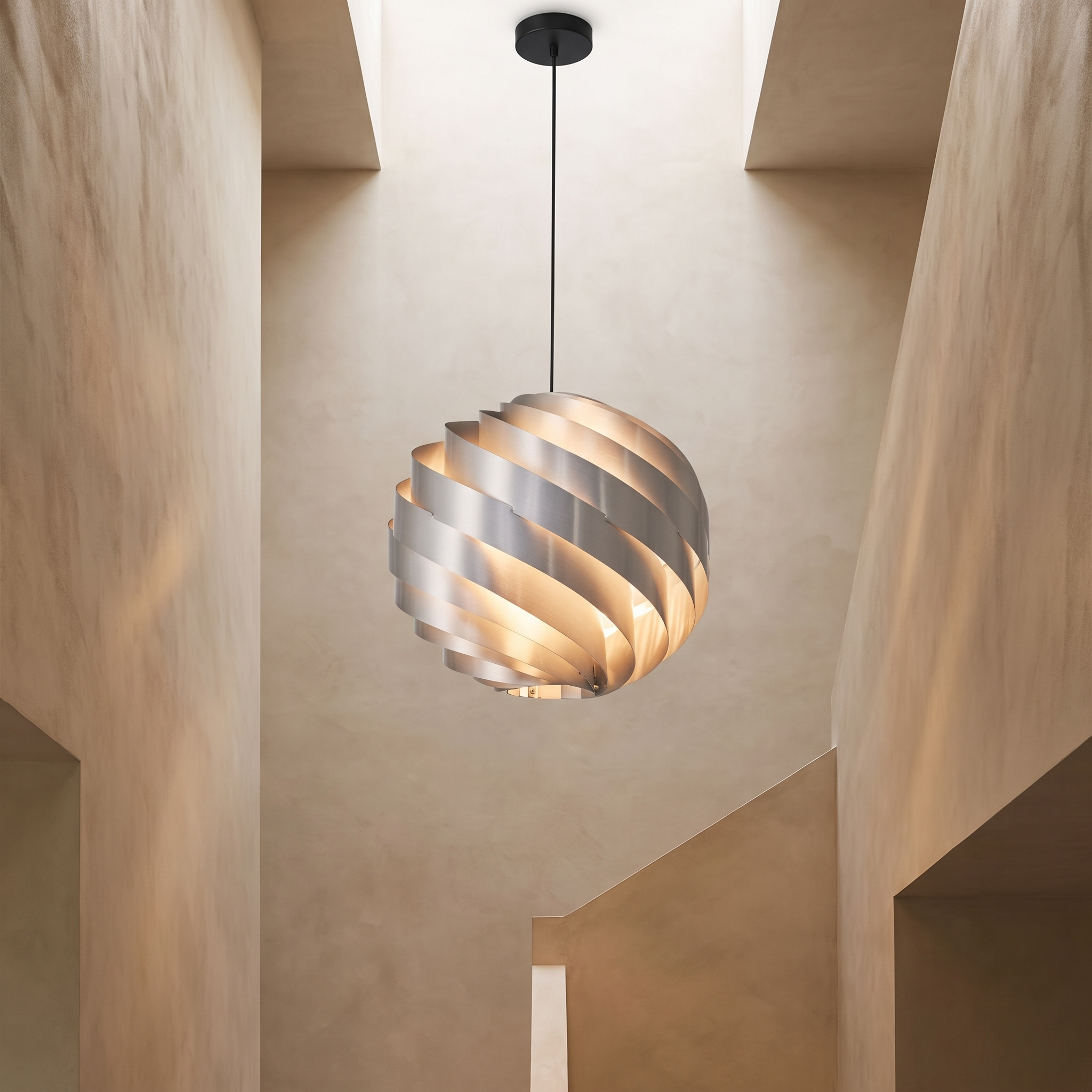 Vortale twisted swirl light in a modern stairwell