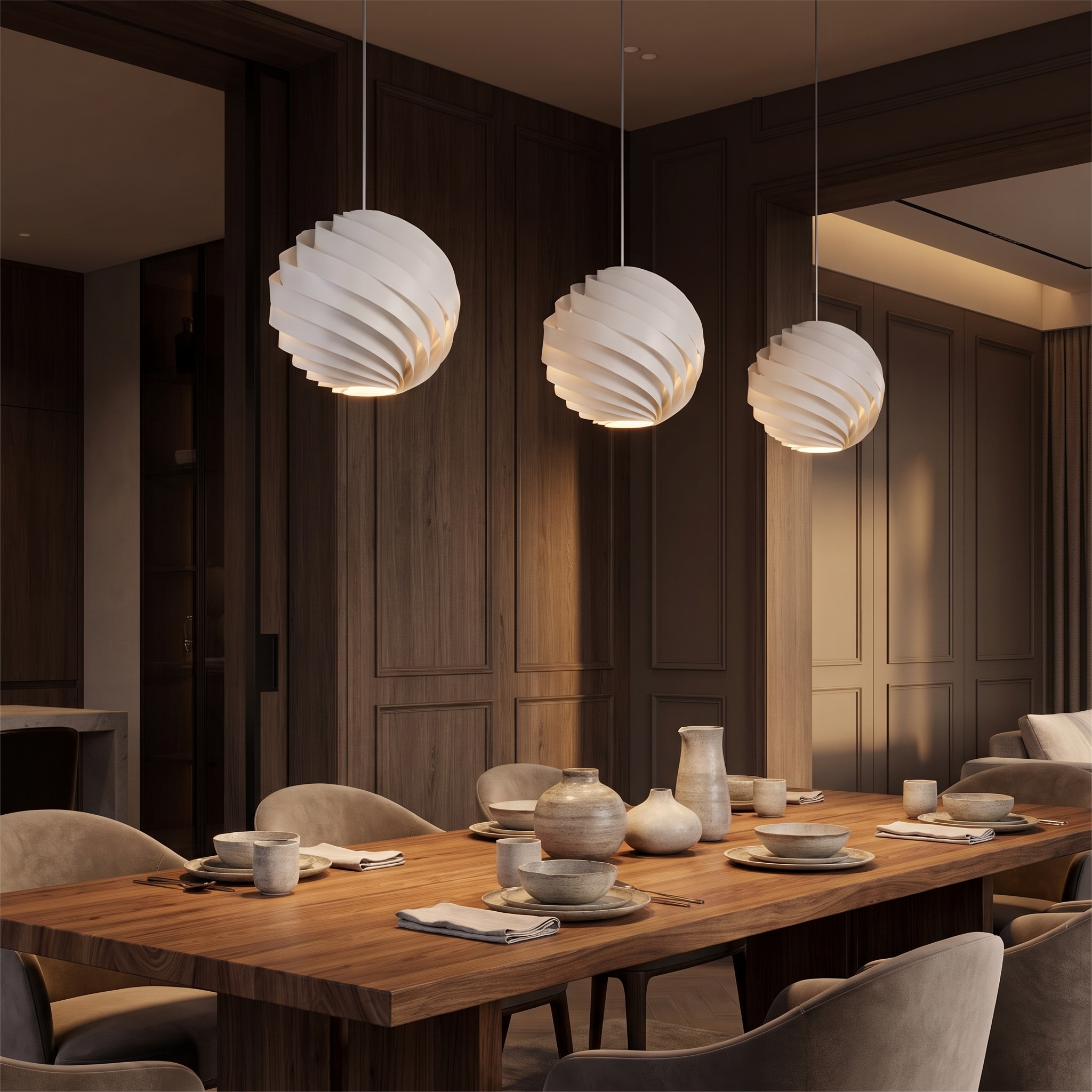 Vortale swirl pendant light hanging over a timber table