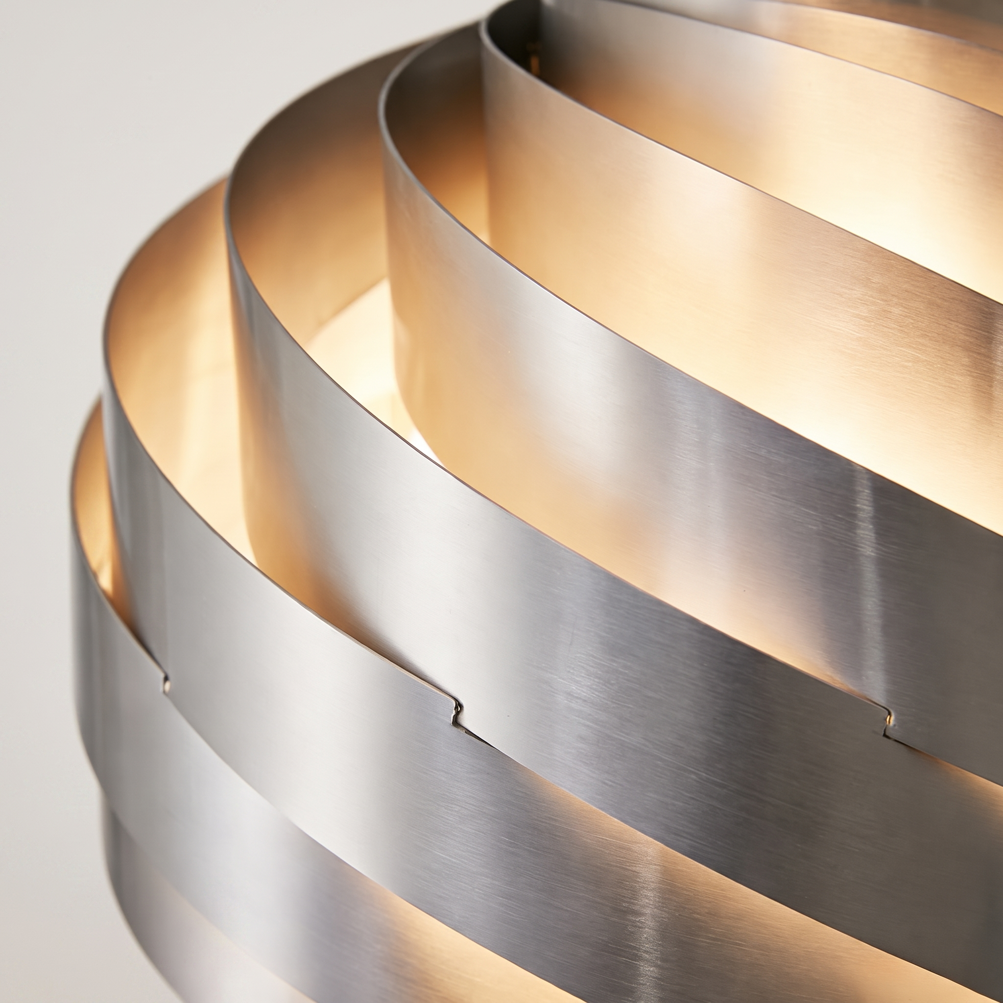 Angled view of the Vortale spiral swirl pendant light