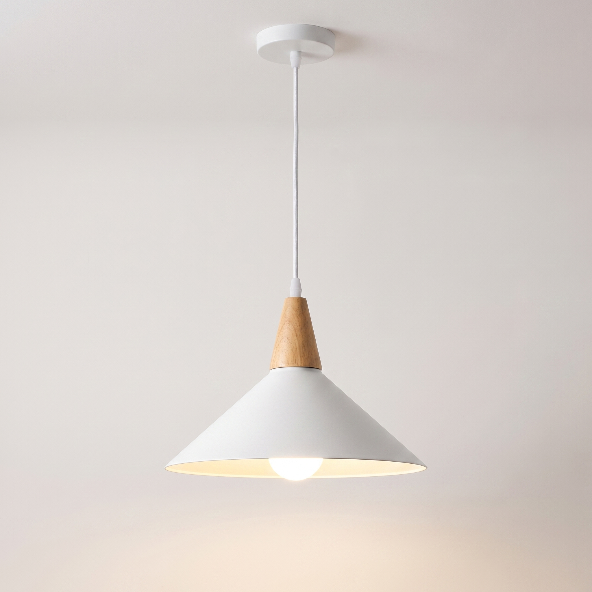 Conica white cone pendant light over a Scandinavian kitchen island