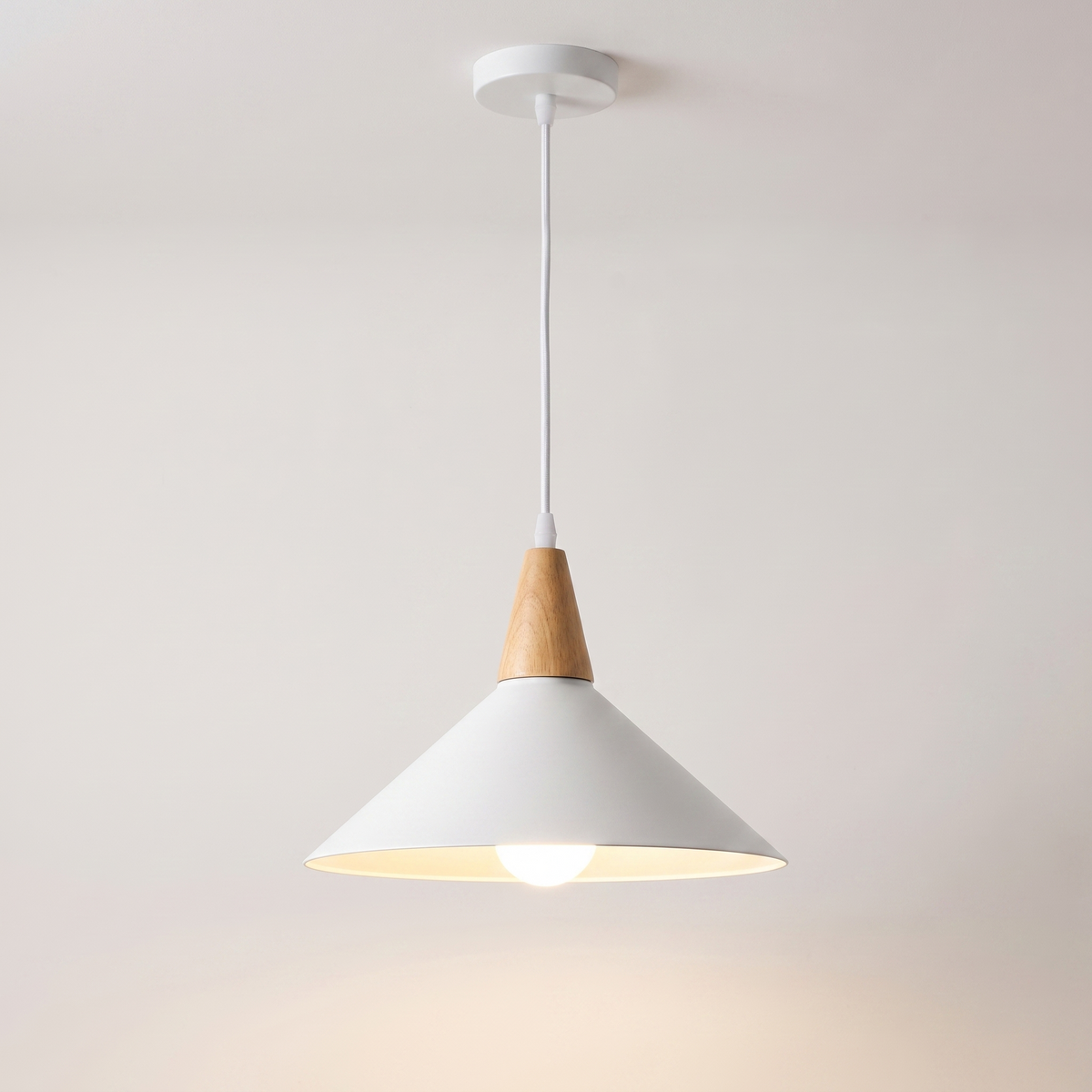 Conica white cone pendant light over a Scandinavian kitchen island