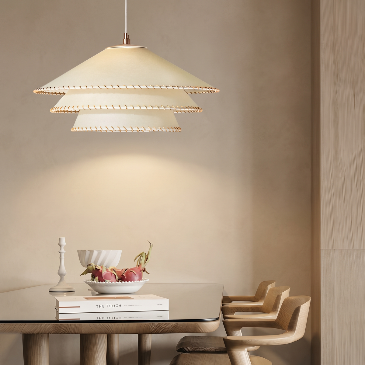 Papyra tiered parchment pendant above a rustic-modern dining table
